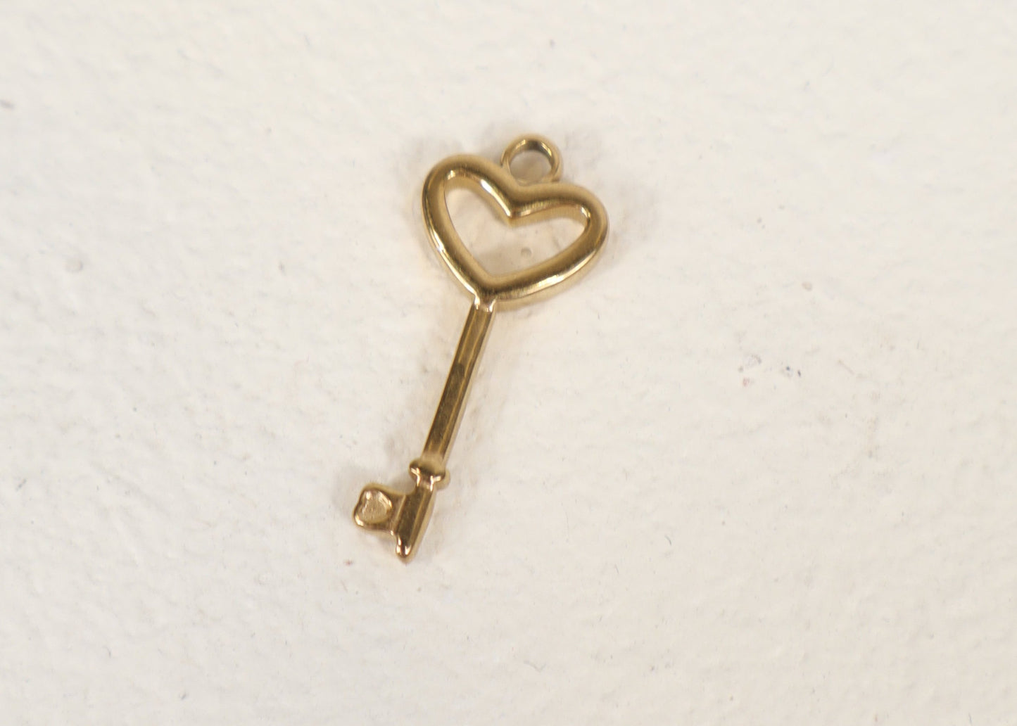 Gold key charm